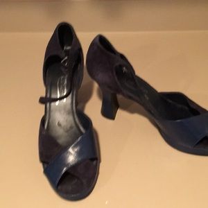 Navy leather and suede heels with an ankle strap